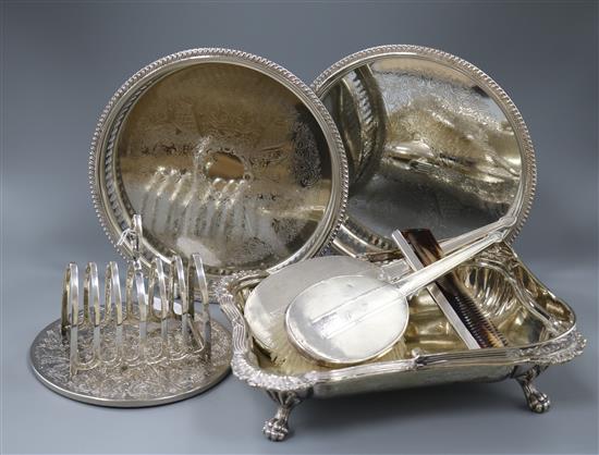 A silver toast rack, a dressing table set and plated items.